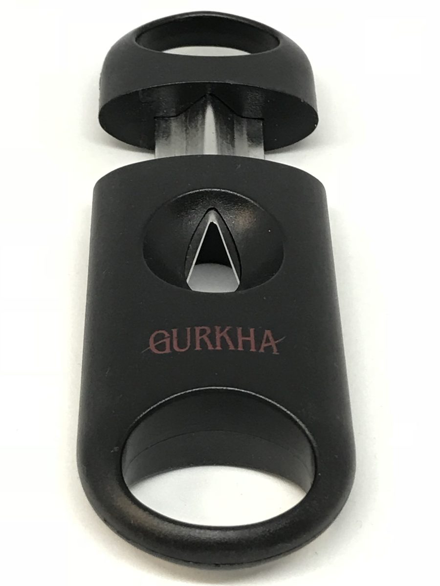 A pocket V-cutter, open. The V-shaped blade sits in the center hole.